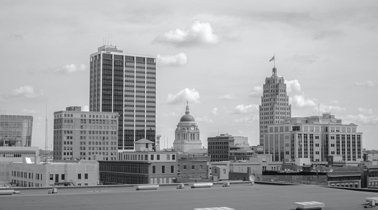 Services Grayscale cityscape of Fort Wayne, Indiana showcasing prominent buildings and skyline.